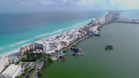 Amazing-panoramic-aerial-view-of-Cancun-hotel-zone-between-blue-Caribbean-Sea-and-Nichupté-Lagoon,-Mexico