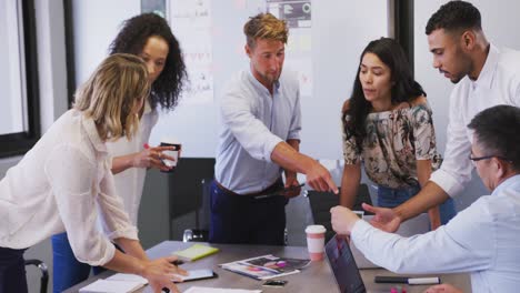 professional businesspeople discussing together in modern office in slow motion