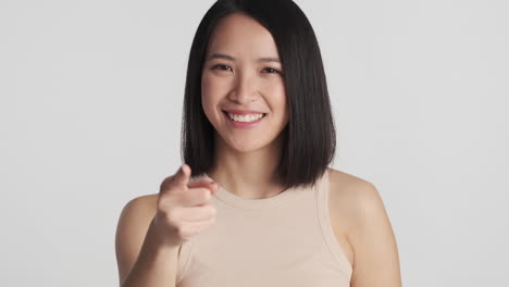 Asian-woman-pointing-straight-to-the-camera.