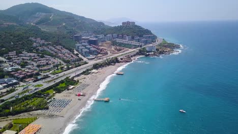 coastal resort town with beach and mountains