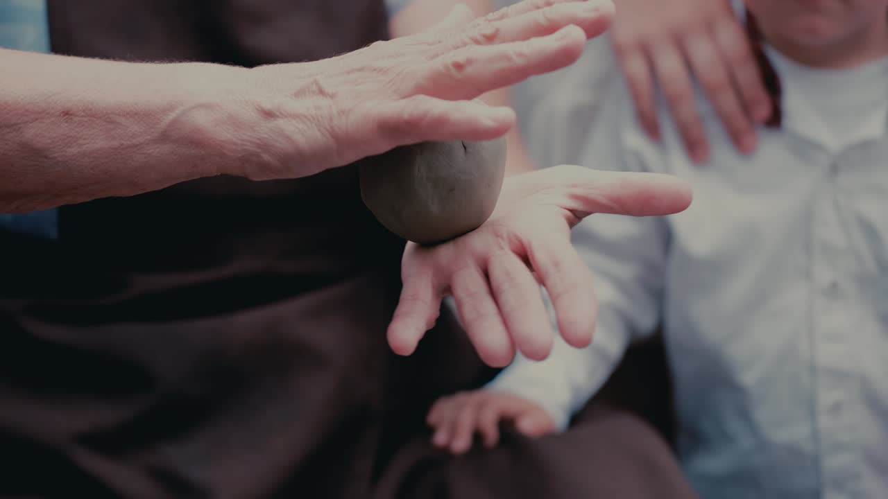 Close up hands make pitchers in pottery