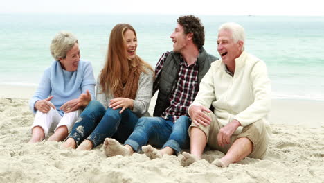 family talking on the beach