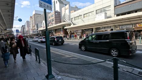 pedestrians navigating a busy urban sidewalk