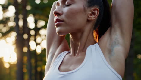 woman stretching outdoors during golden hour