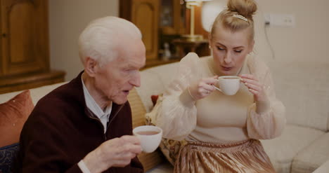 granddaughter listening to grandfather in christmas