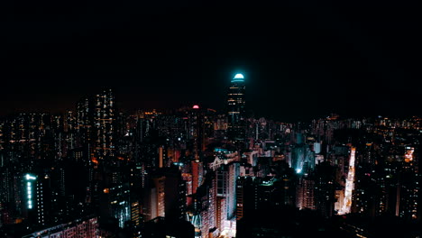 drone shot, traveling upward, of a big city during the night with a landmark business building in the middle. the streets are busy and give the shot a cyberpunk atmosphere.