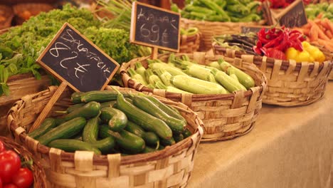 a selection of fresh vegetables for sale at a farmers market.