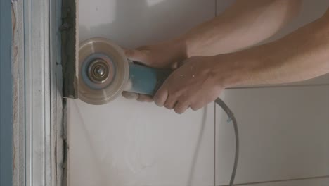 cutting a wall in a bathroom