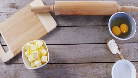 butter cubes and egg yolk on a wooden table 4k