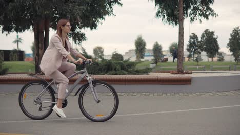 woman cycling in a city park