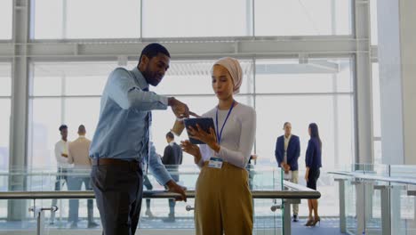 business executives discussing over digital tablet in the office 4k