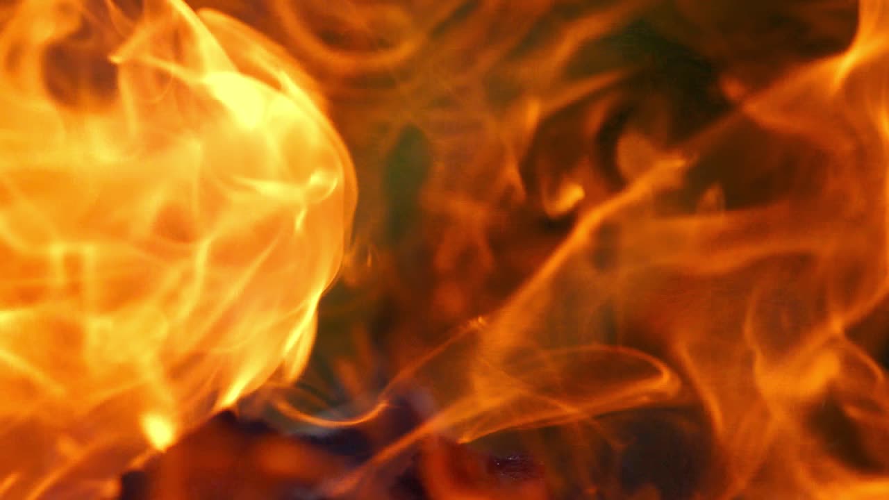 Bonfire burning at night. Flames of fire on black background. Fire flame