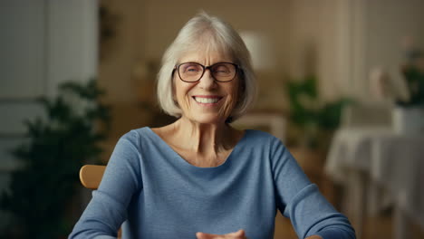 portrait of a smiling senior woman with glasses