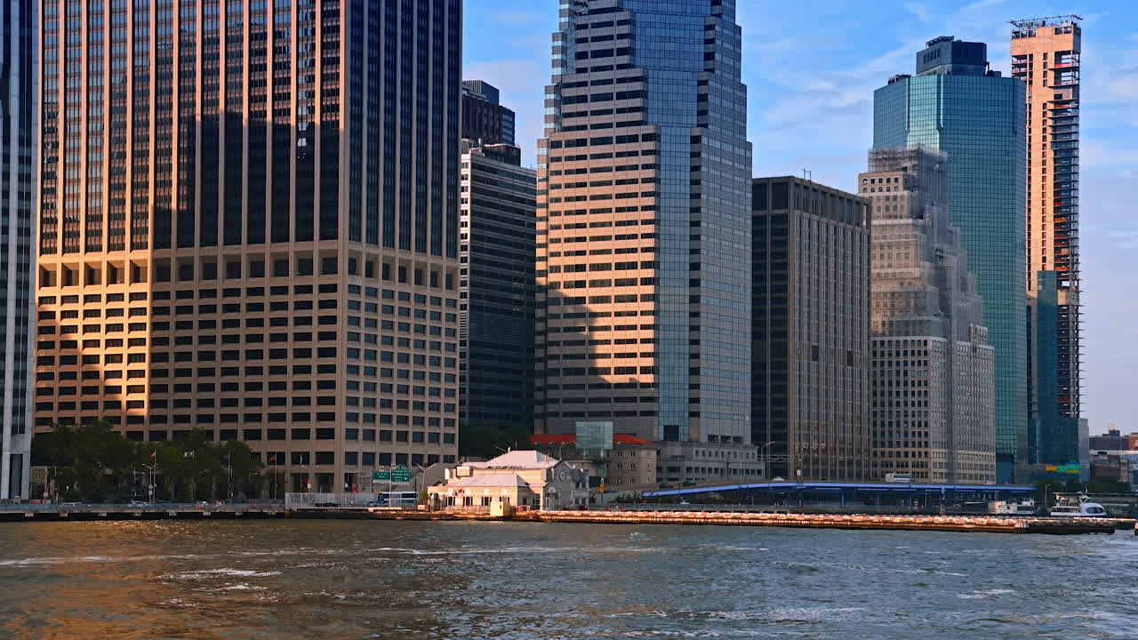 Modern huge high-rises built on the waterfront of the East River. New York architecture from the boat travelling by the river
