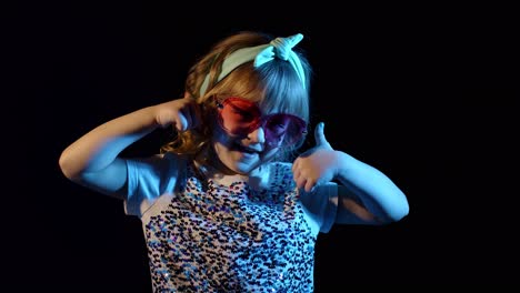 fashion, gorgeous girl dancing alone, showing thumbs up in futuristic night club with neon lights