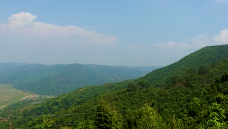 agriculture farming fields surrendered by mountain at morning from top angle