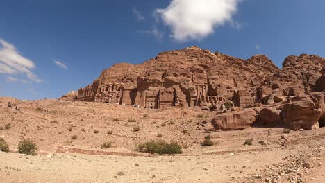 the cliffs and ancient tombs of the rose city of petra, jordan in a walking hyper lapse