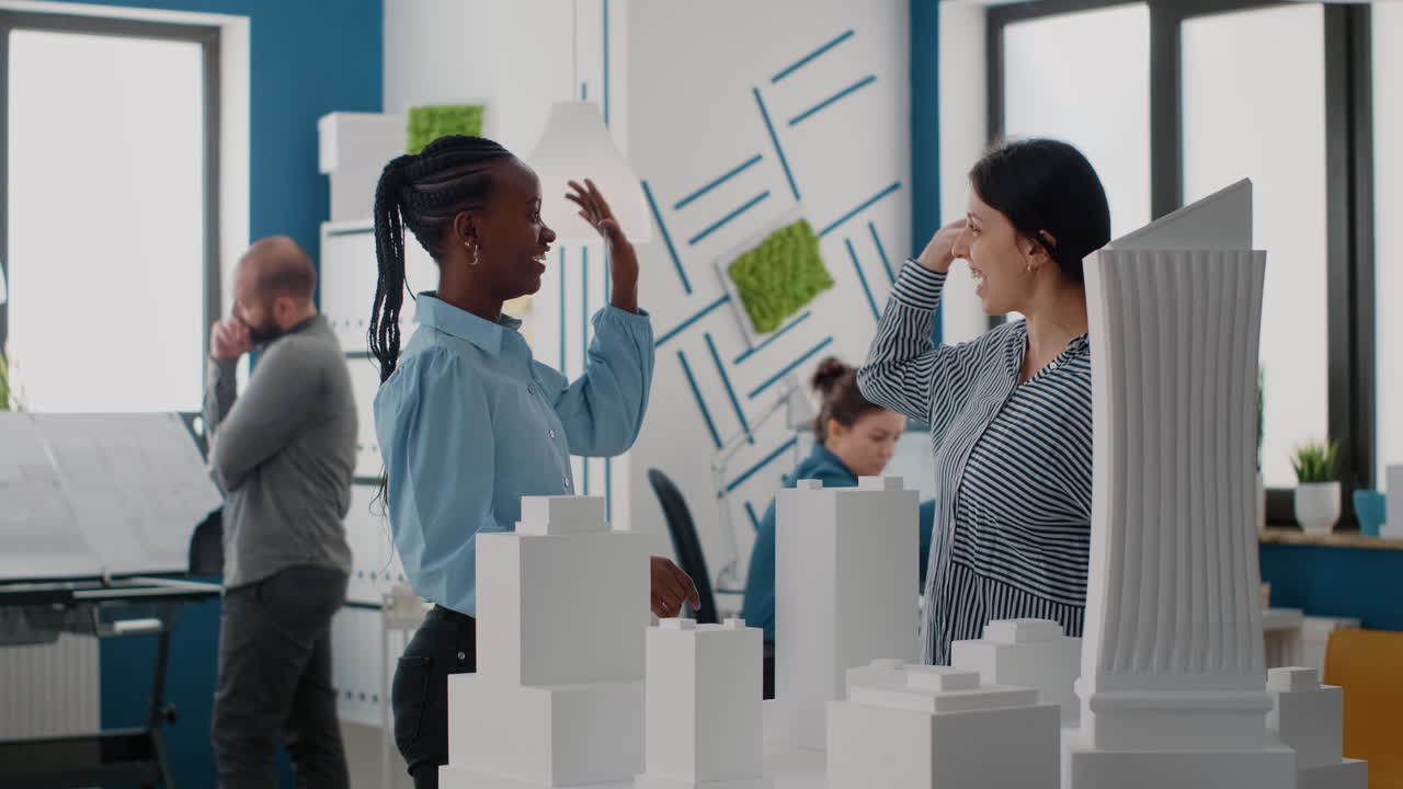 Architects Collaborate on Building Design with Scale Model