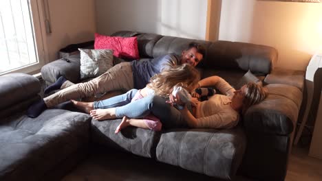 family bonding and playing on the couch at home