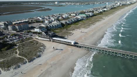 dynamic aerial shot of crystal pier, wrightsville beach north carolina beach front