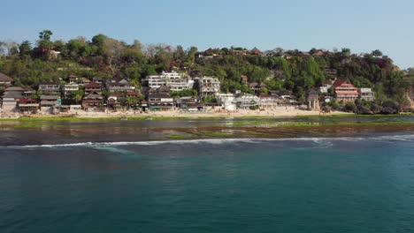 The-surf-spot-of-Bingin-at-the-cliffs-of-Uluwatu-during-a-sunny-day