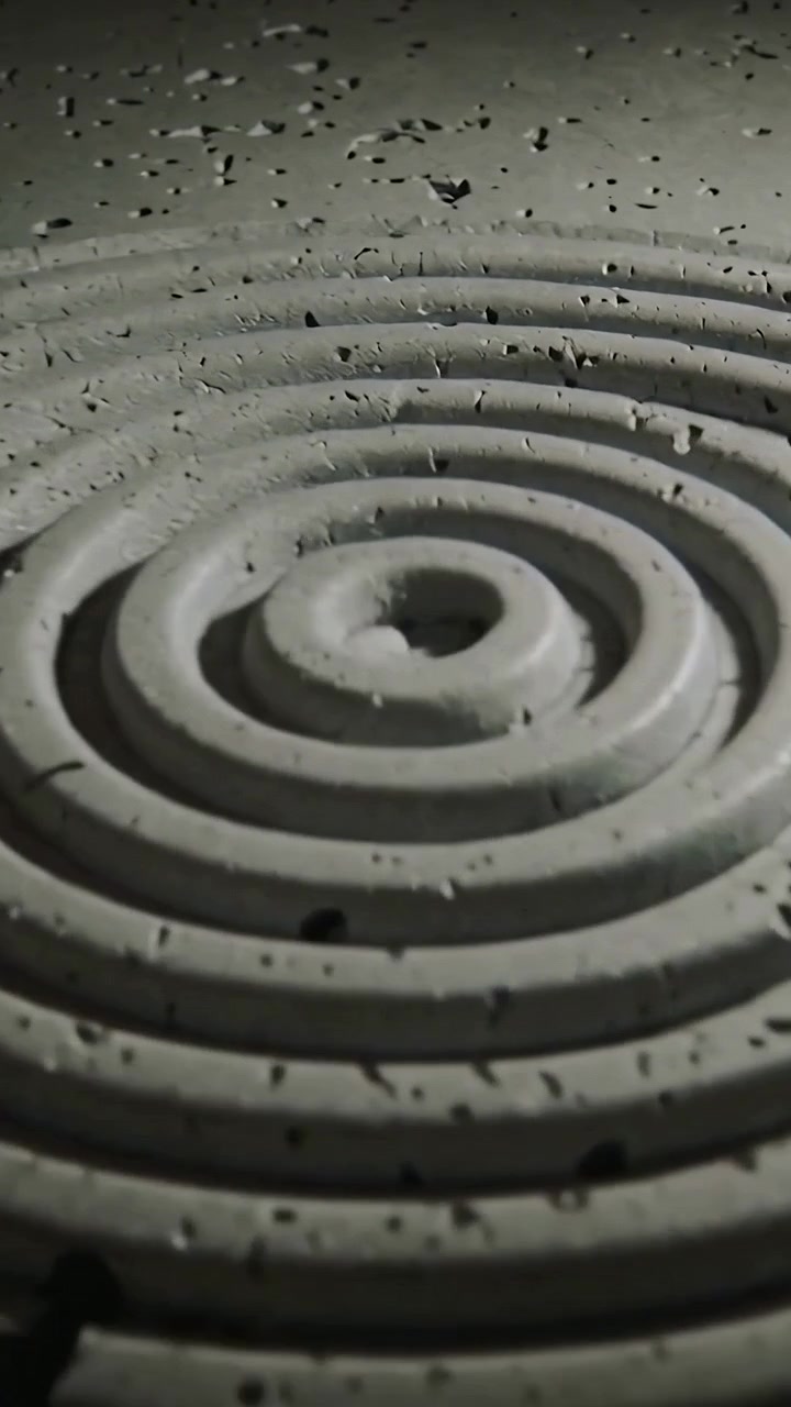 Vertical video: Moving phone revealing concentric rings on work table to show texture and chips