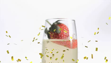 Animation-of-strawberry-falling-into-champagne-glass-with-confetti-falling-on-white-background