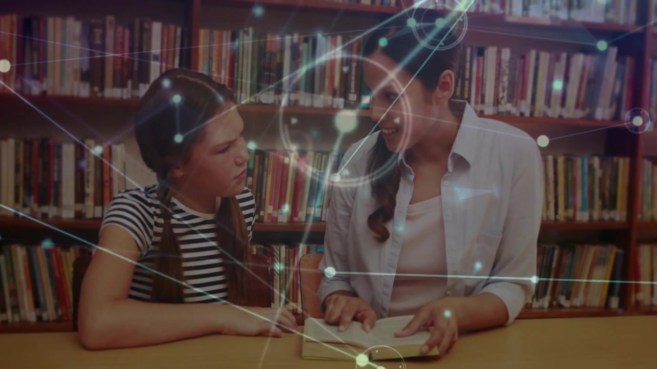 Female tutor opening textbook guiding student reading in library with network graphic for education