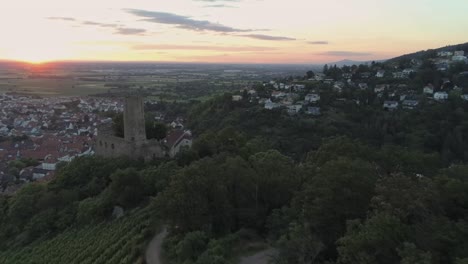 zooming out aerial view of historic castle in schriesheim germany during a beautiful sunset.
