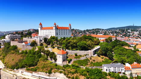 Bratislava Castle surrounded by the lush greenery. Drone footage on the scenery of beautiful landmark on sunny day