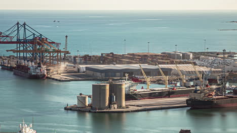 Cargo-port-of-Malaga,-Spain-in-a-timelapse,-cranes-working-and-ships-moving