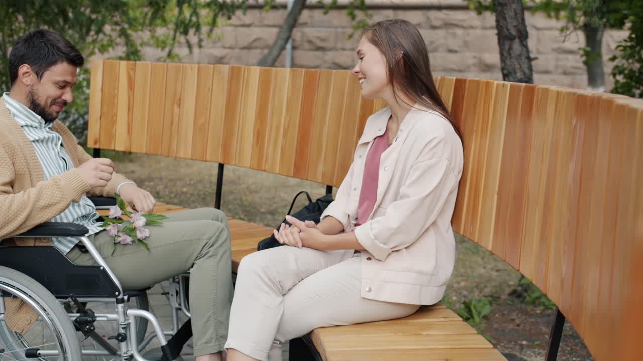 Couple in Wheelchair and Bench