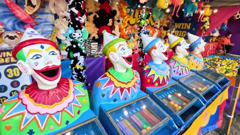 colorful clown heads at a carnival game