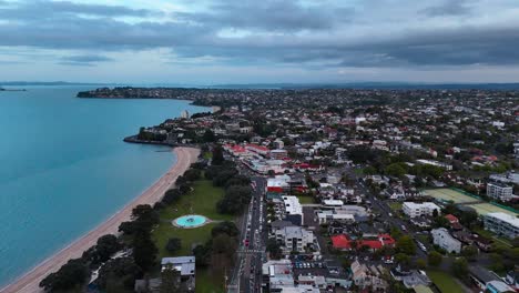 mission bay in suburb of auckland city during cloudy day