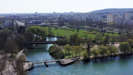 beautiful city park with lake and bridge