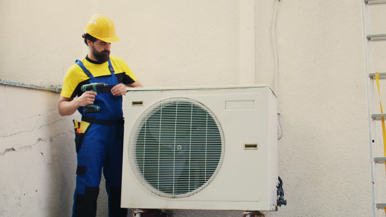 Expert wireman works on air conditioner