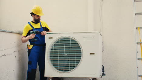 expert wireman works on air conditioner