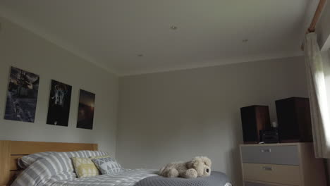 downward tilt shot of a modern looking bedroom in a family home