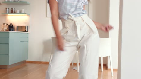 Dancing-woman-in-home-living-room