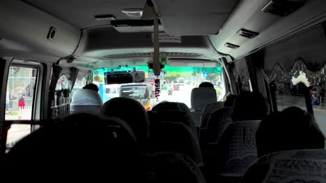 passengers inside a tour bus traveling on a scenic route, capturing the spirit of adventure and exploration. relaxing atmosphere as they journey together.