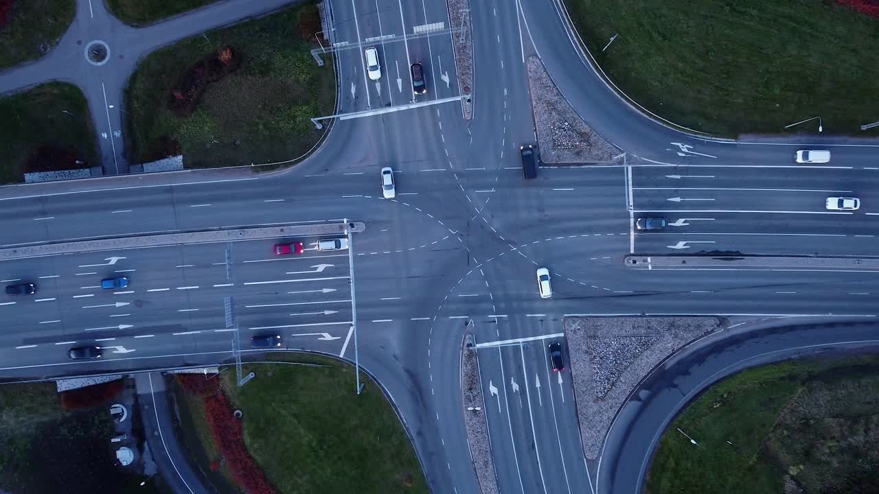 Bird's eye view: Cars look like toys driving thru highway intersection