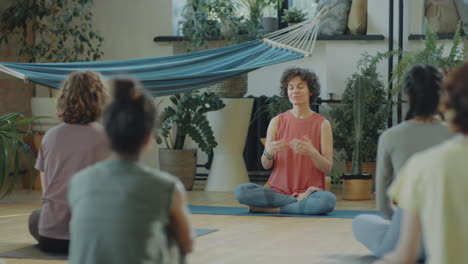 women participating in a yoga and meditation class