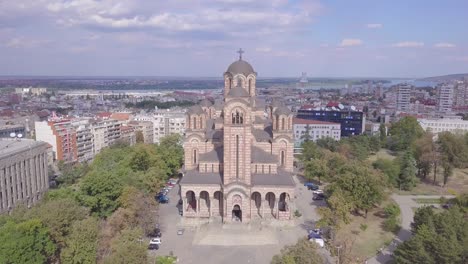 Incredible-establishing-aerial-shot-of-St-Mark-Church-in-Tasmajdan-park-in-Belgrade
