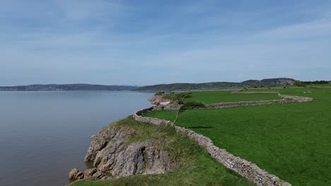 morecambe bay coastal farming countryside aerial view over stone wall towards mountain horizon