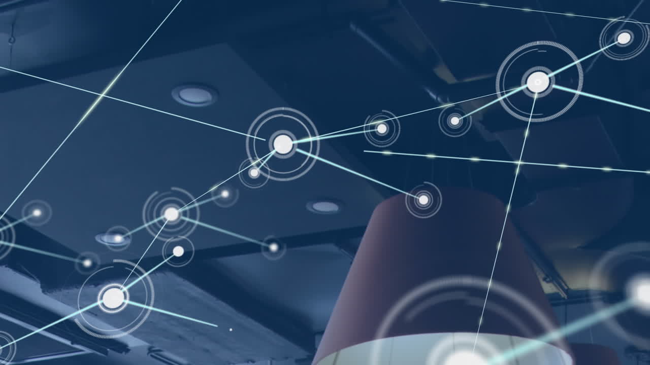 animación de puntos que se conectan con líneas y se mueven bajo la lámpara eléctrica y el techo de la oficina