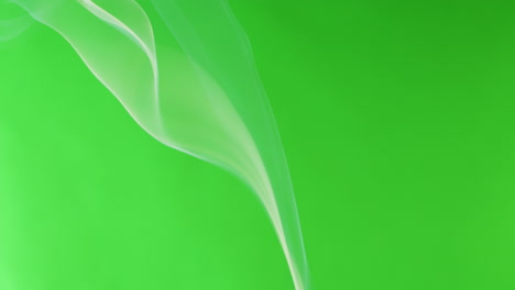 white smoke on a green background