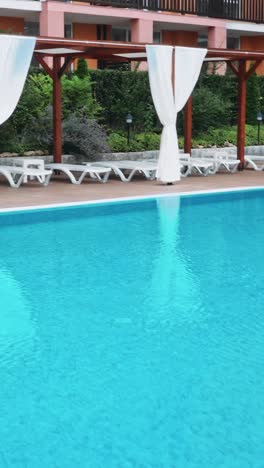 beautiful luxury umbrella and chair around outdoor swimming pool
