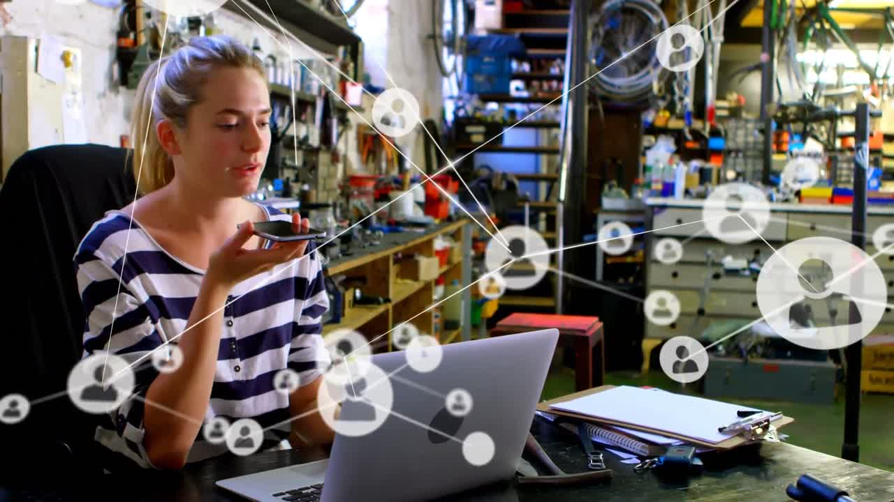 animación de una red de conexiones con iconos sobre una mujer caucásica feliz usando un teléfono inteligente