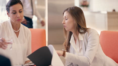 Multi-Ethnic-Business-women-working-in-business-lobby