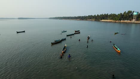 aerial drone shot capturing a fisherman in action in udupi's ocean waters